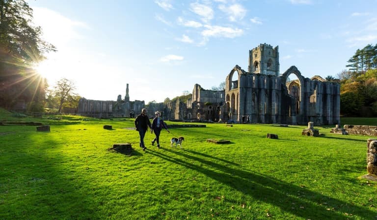 Couple and dog on East Green Credit Chris Lacey Medium