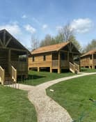 How Stean Gorge exterior view of rustic wooden lodges Yorkshire Dales with Hot Tubs