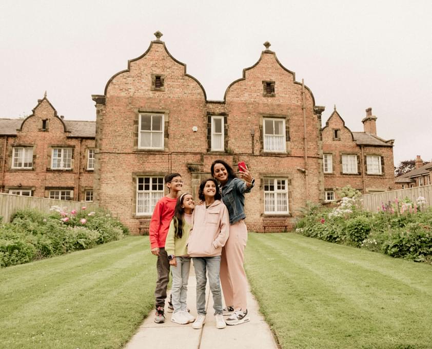 Family enjoying country house garden